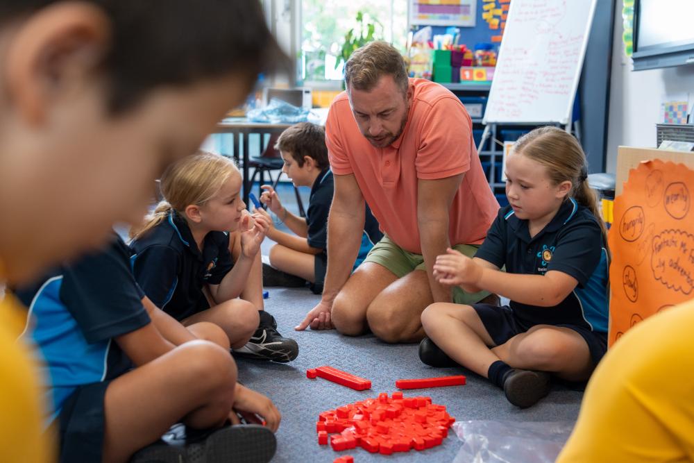 Students discuss with teachers