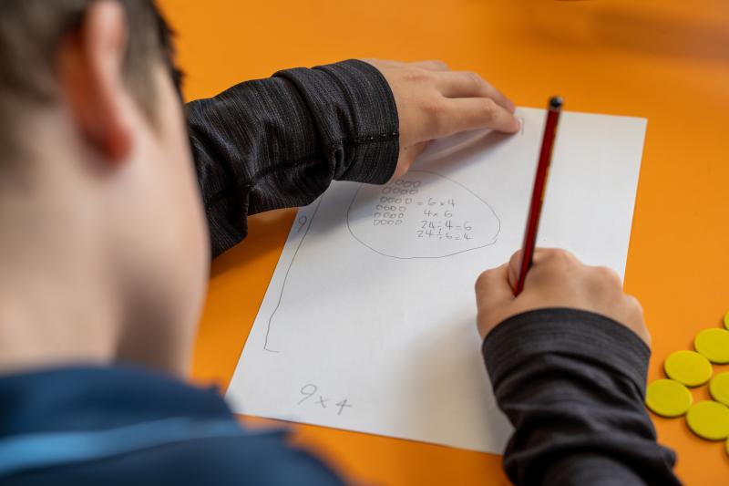 Student writes division problems