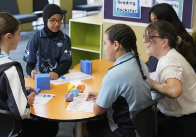 Teacher discussing with students