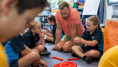 Students discuss with teachers
