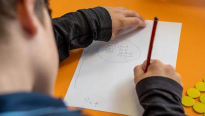 Student writes division problems