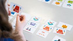 Over the shoulder of a student playing with the robot cards. 