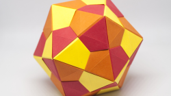 An origami icosaderon made of orange and red paper