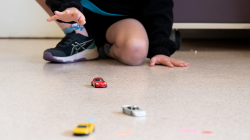 Student pushes toy car