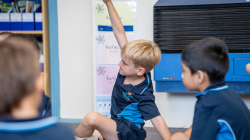 Student with hand raised