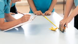 Students measure frog jump distance