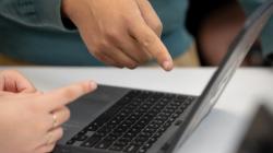 Student's hands at a laptop