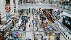Overhead image of people shopping in a large supermarket