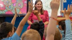 Students with hands up
